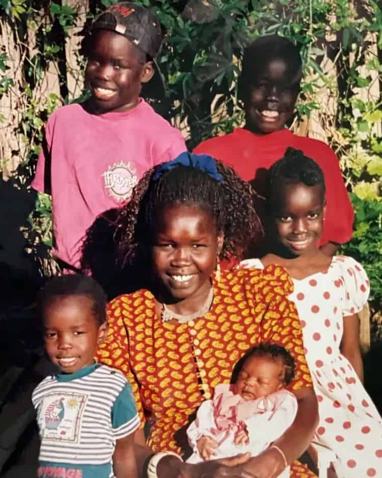 Atong (in polka dots) with her mother and siblings IMAGE: INSTAGRAM @ATONGATEM