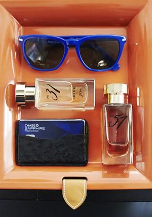 Cool cobalt sunnies complement a couple of Arquiste fragrances