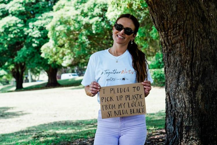 Julia Stone with the weDo team outdoors in matching white TogetherWeDo t-shirts for Clean Up Australia Day