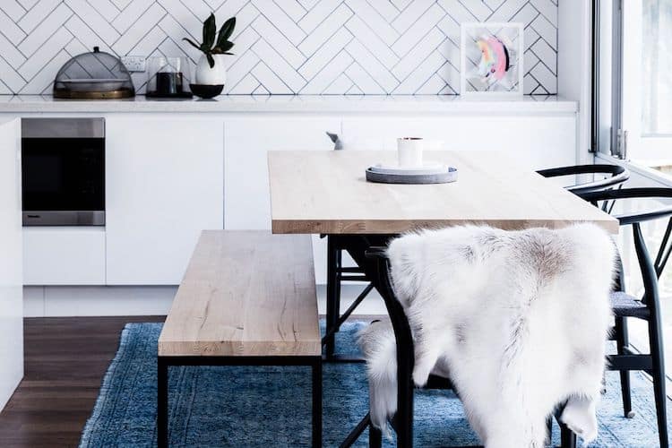DINING TABLE BY SMITH MADE FROM MCM HOUSE, TILES FROM DI LORENZO, TURKISH RUG FROM SMITH MADE, ETHICALLY-SOURCED REINDEER HIDE FROM HIDES OF EXCELLENCE, QUEEN OF THE NIGHT CANDLE FROM GRANDIFLORA