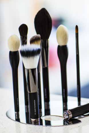 Rae Morris magnetic makeup brushes standing upright