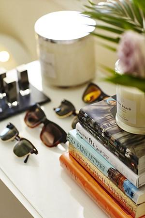 Sally Spratt styled vignette with Ray-Bans and Palm Beach candles