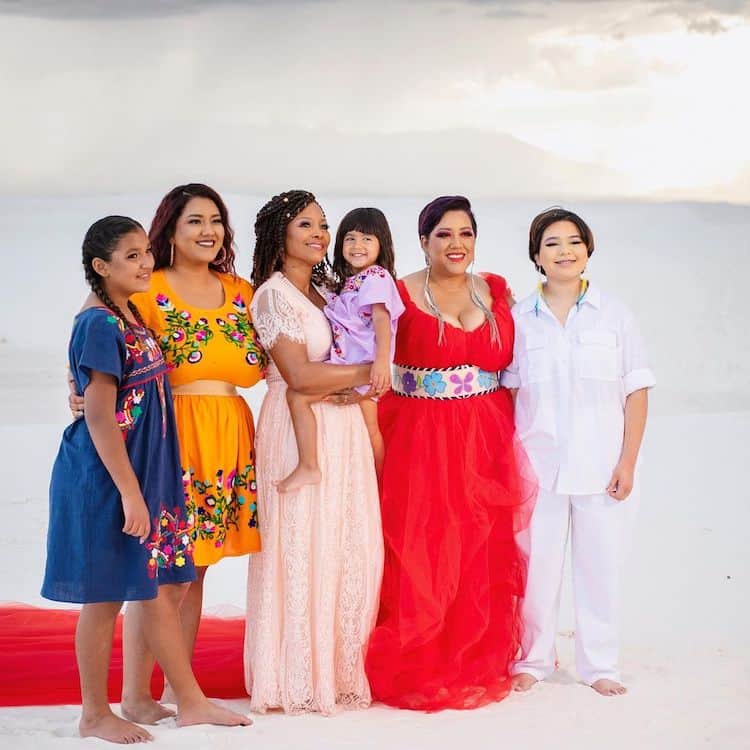 CECE (IN RED) WITH “my Godmother, Mama Teresa, my sister, and our babies Eli, Alexia and Cheyenne Rain” Photographed by Hannah Manuelito on location at White Sands National Park in collaboration with Kanion, via Instagram @cecemeadows