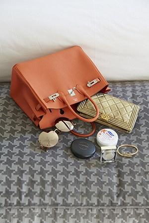 Inside Roxy’S Hermes Birkin Bag – A Golden Chanel Wallet, Cartier Bracelet, Mac Pressed Powder And Her Favourite Pair Of Mirrored Sunglasses