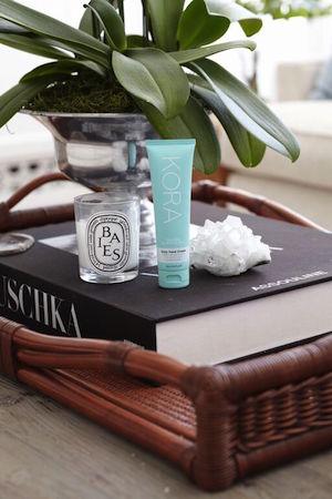An Orchid, Crystal, Diptyque ‘Baies’ Scented Candle, Kora Organics Daily Hand Cream And A Book By Assouline Are The Centre Piece Of Miranda’S Coffee Table
