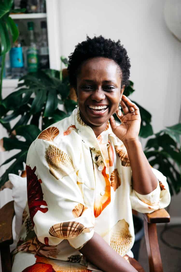 Aminata wears Oroton Silk Ocean Shell Print Dress
