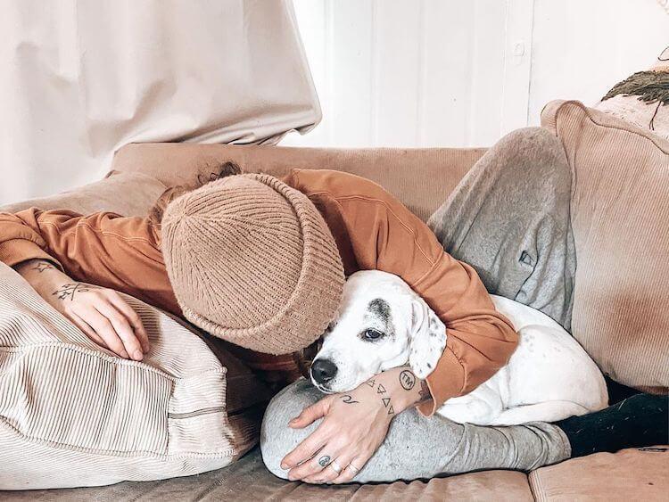 Jessi snuggling with one of the couple’s adored rescue dogs IMAGE: INSTAGRAM @JESSIANDMILLIE