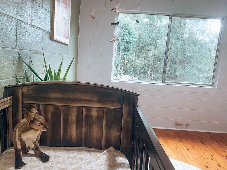 A reclaimed driftwood mobile, a rehoused cot (and a fluffy kanga) awaiting the new arrival IMAGE: INSTAGRAM @JESSIANDMILLIE