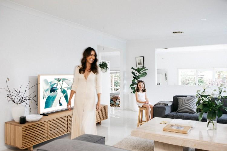Living room with the Linear Entertainment Unit and Diptyque candles on top alongside pot plants