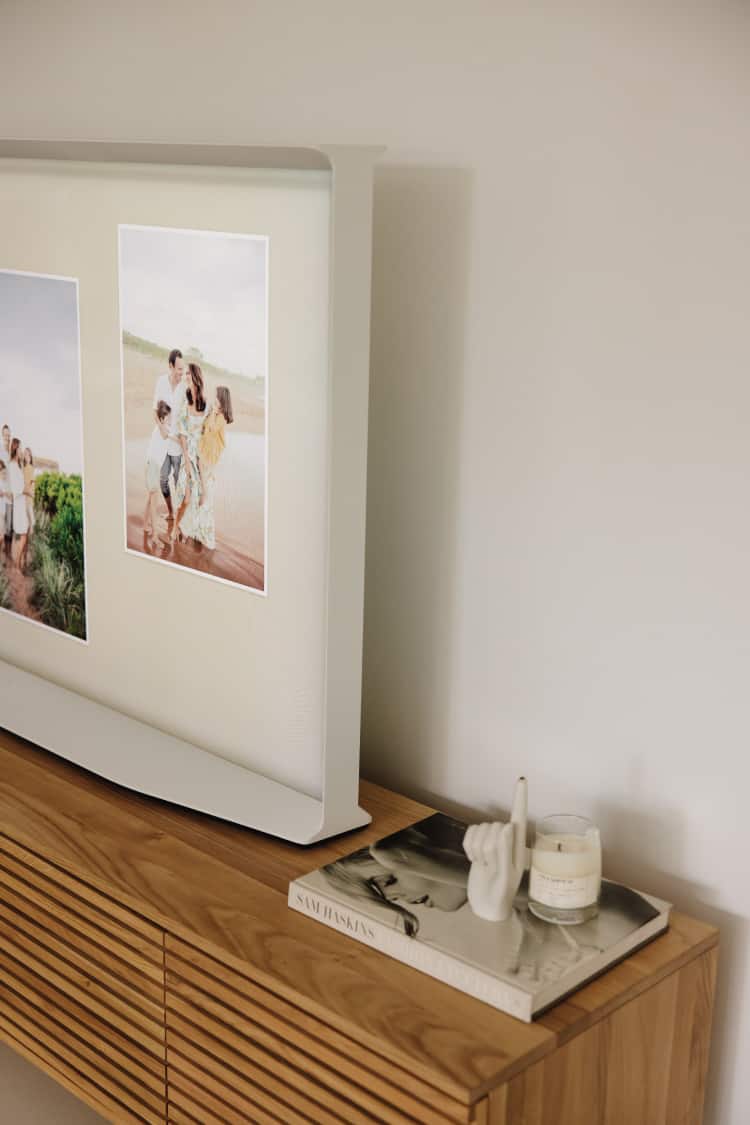 Samsung The Serif TV in portrait-style view showing its slim design on an entertainment unit