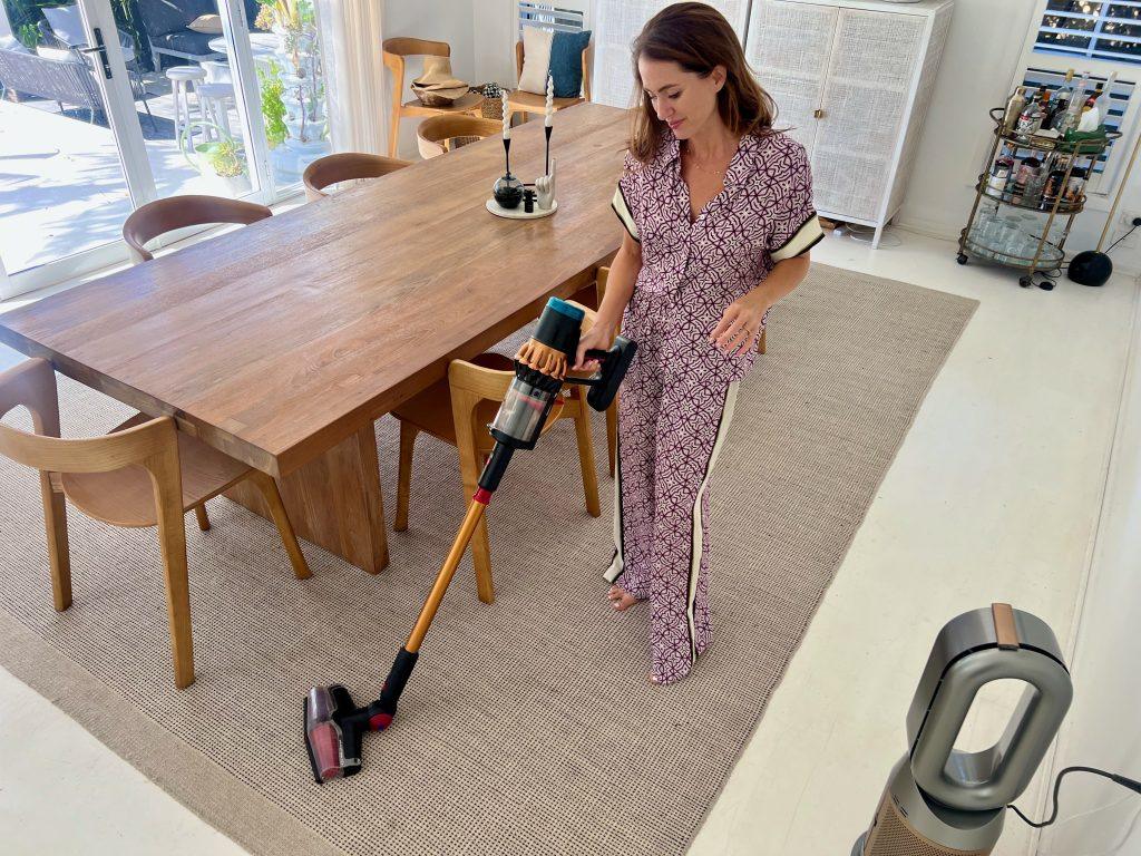 vacuum removing dirt from carpet