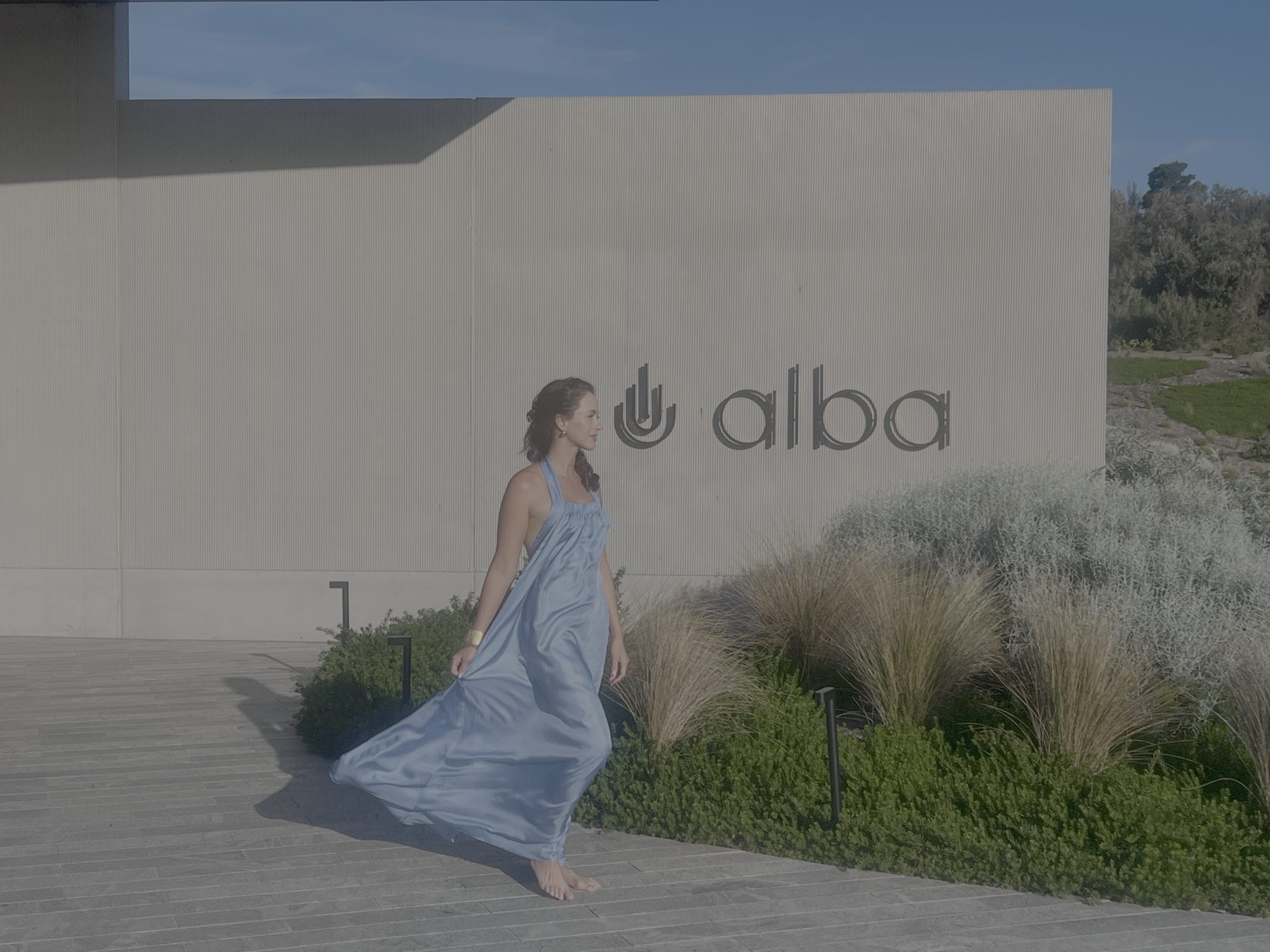 Sigourney Cantelo arriving at Alba Thermal Springs in a blue dress