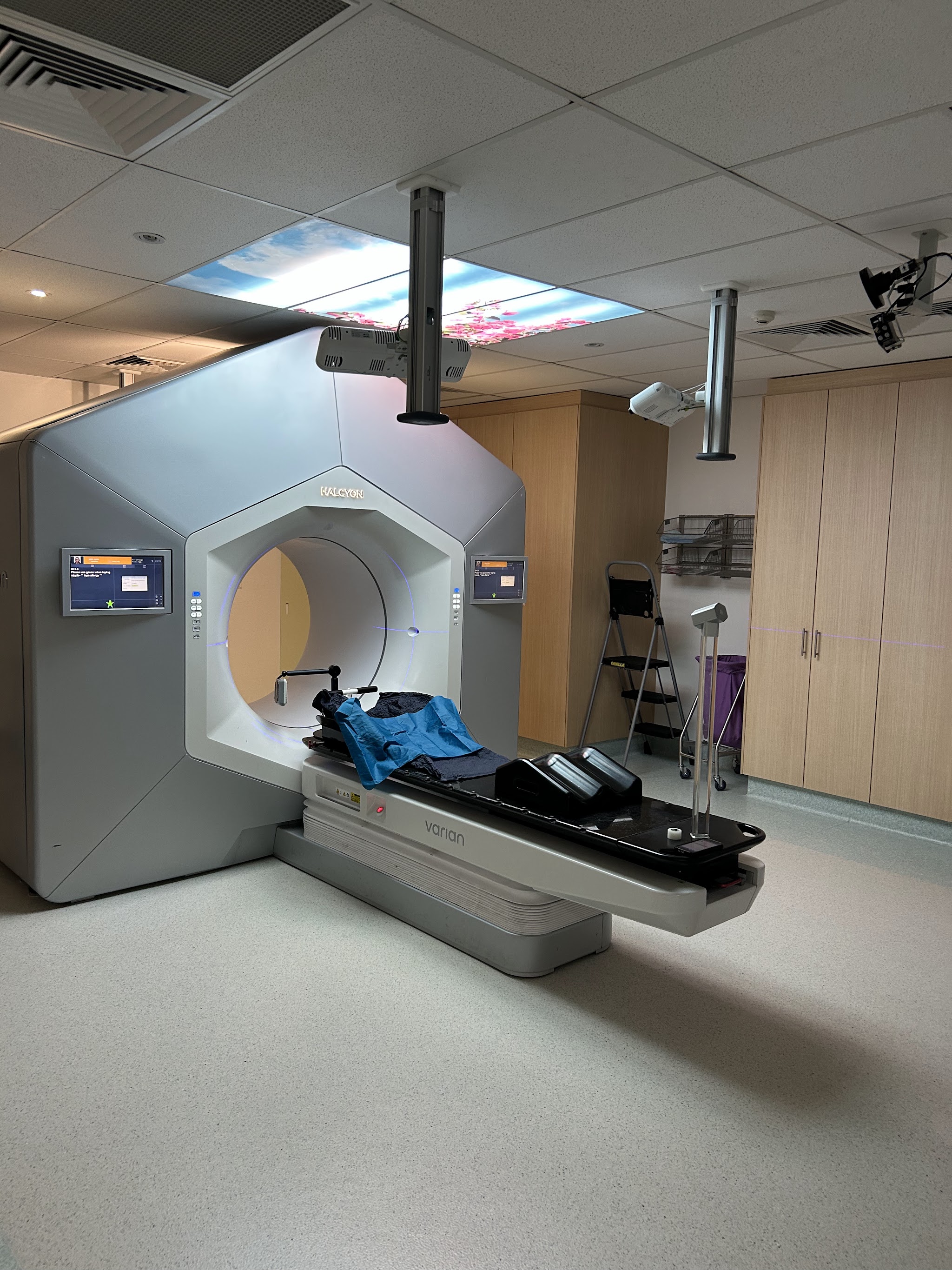 The Varian Halcyon radiation therapy machine at Icon Cancer Centre, with a cherry blossom ceiling panel above