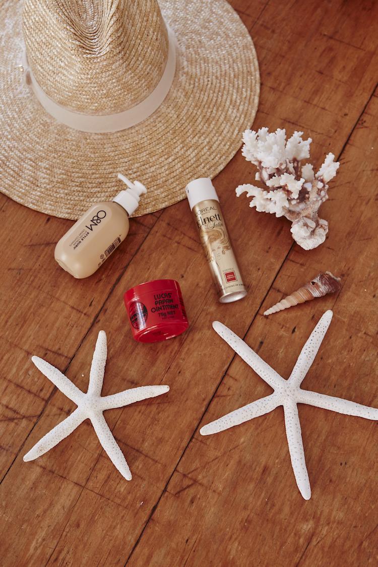 Jennifer Hawkins curling hair for beach waves