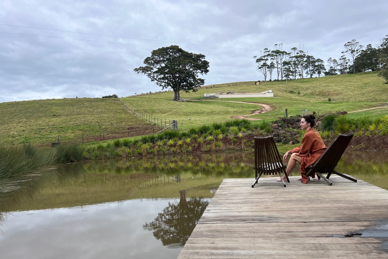 woman at a dam looking out at the scenery