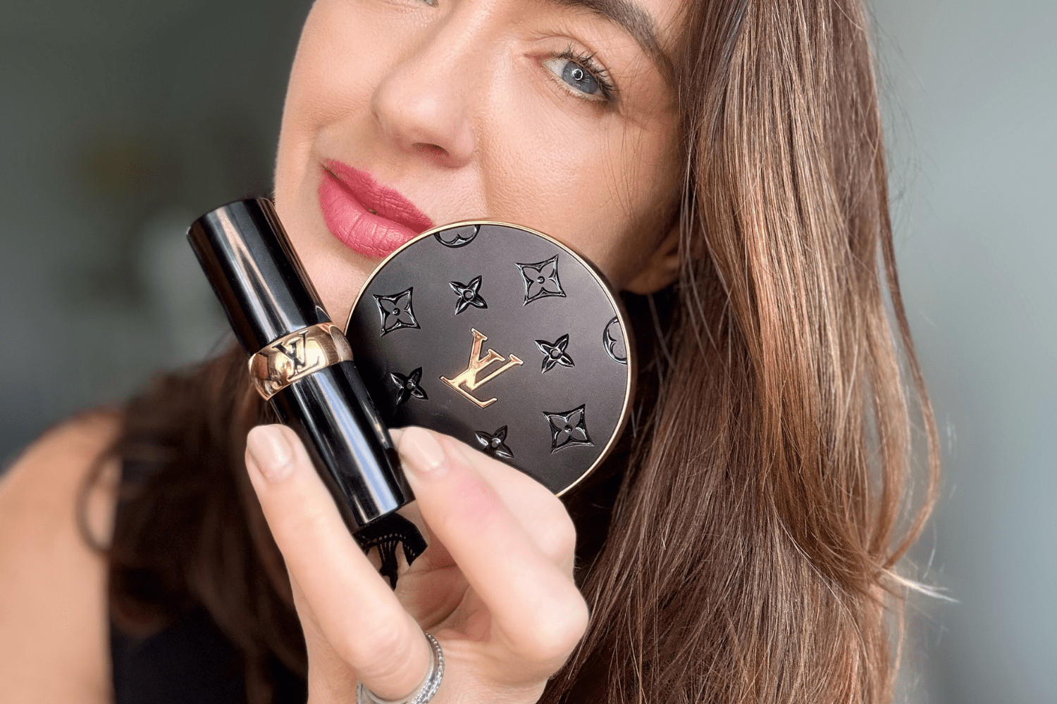 Beauty editor holding Louis Vuitton Lipstick and Eyeshadow