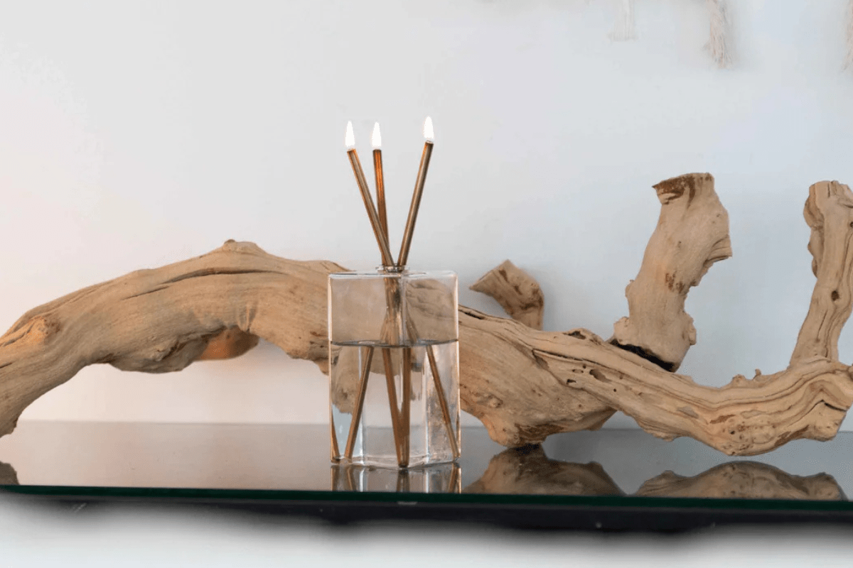 candle on shelf with wood decoration