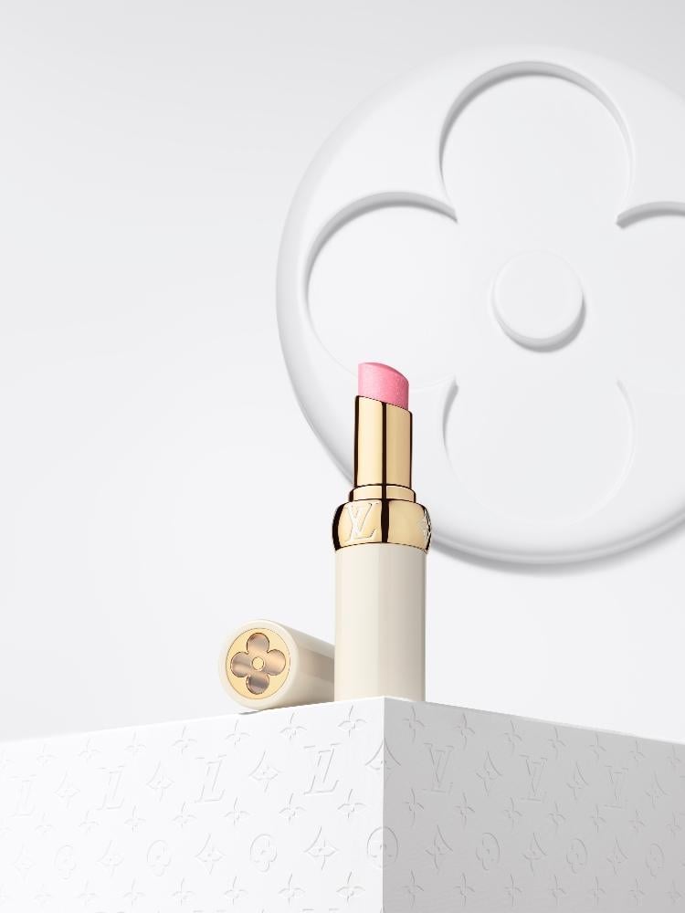 LV Baume lip balm in tender bliss displayed against a white backdrop with Louis Vuitton symbols