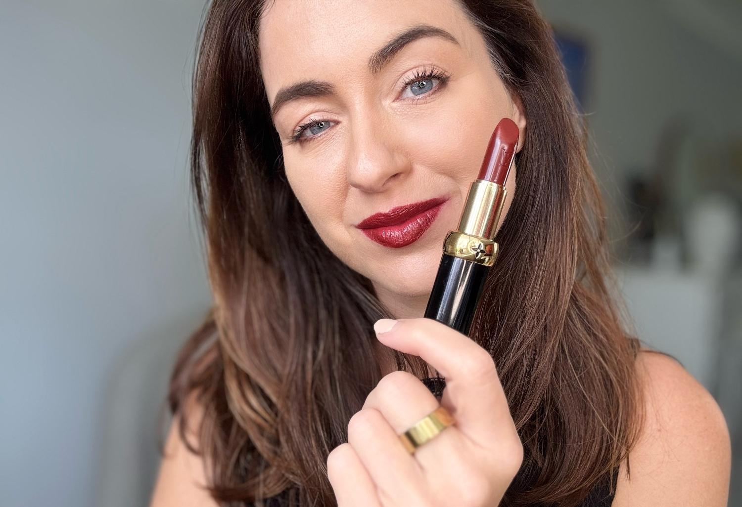 Brunette trying on Louis Vuitton Monogram Rouge