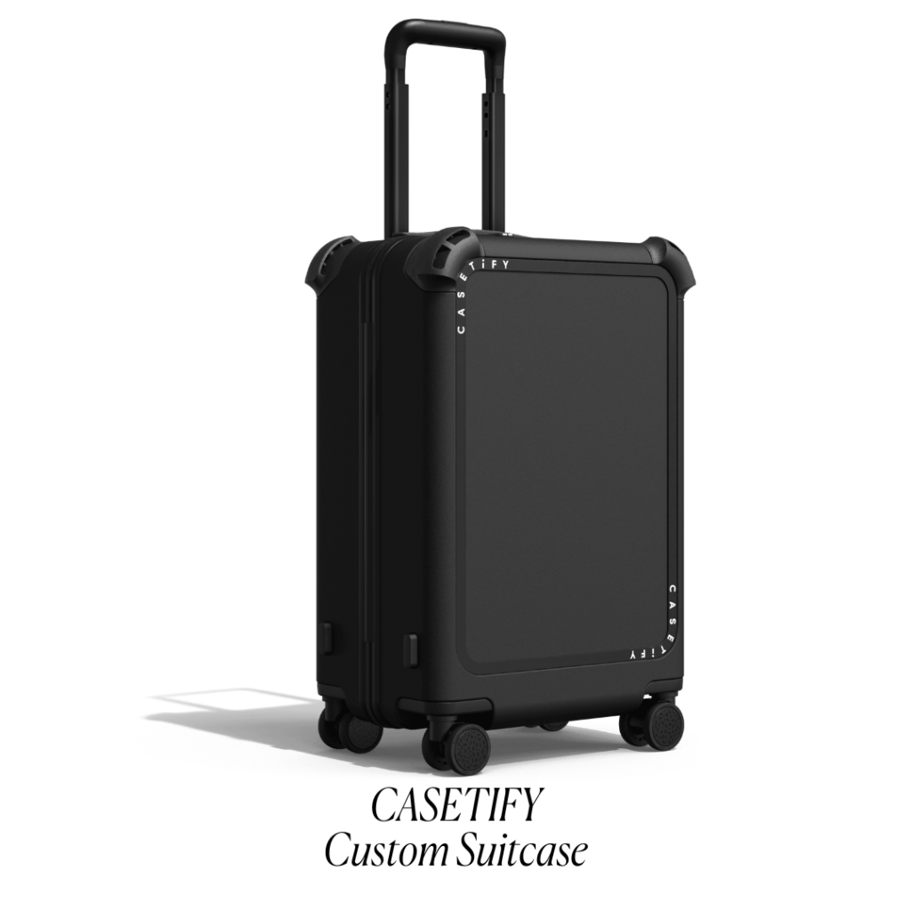 Black Casetify Suitcase Flat Lay