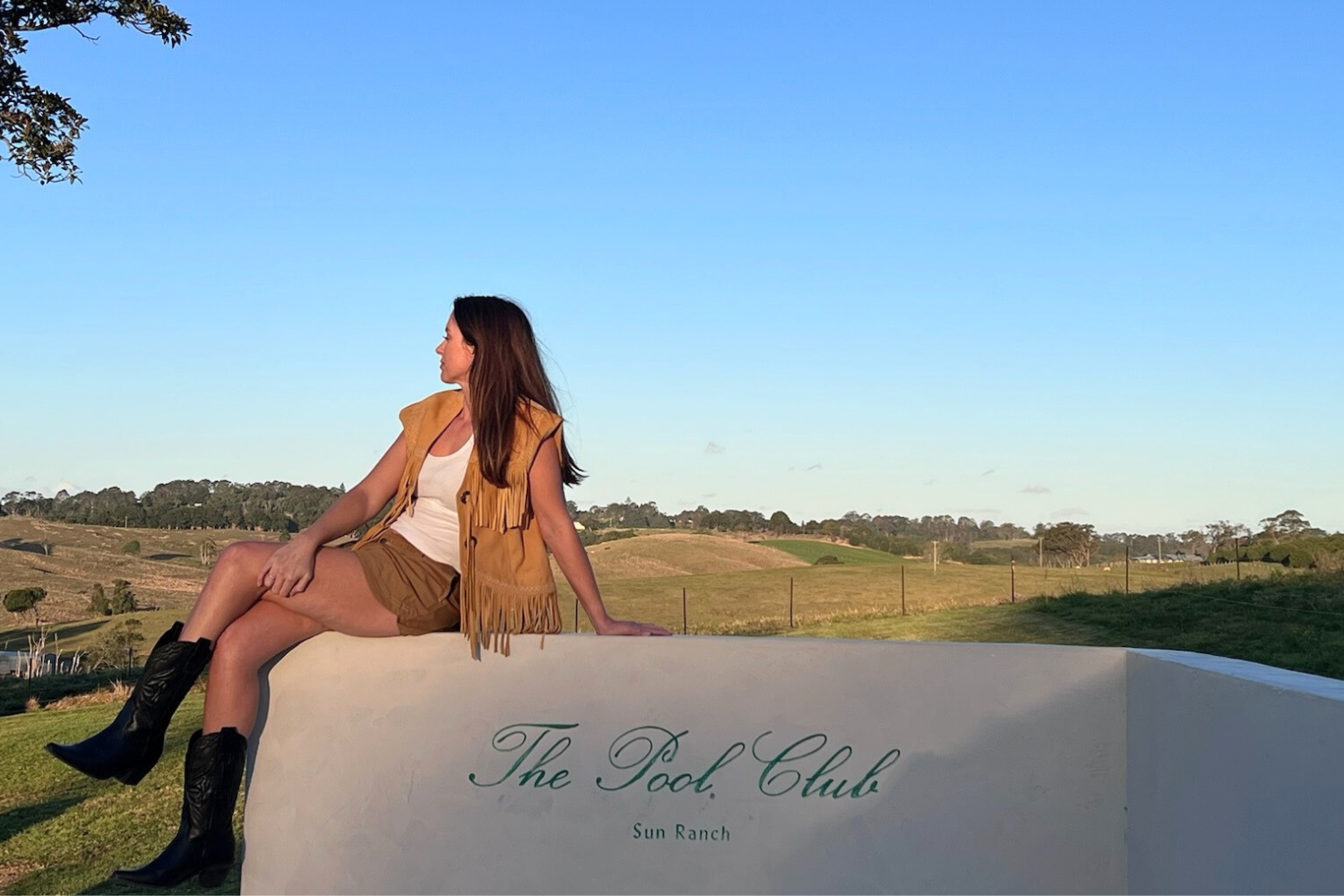 woman looking at view on pool wall