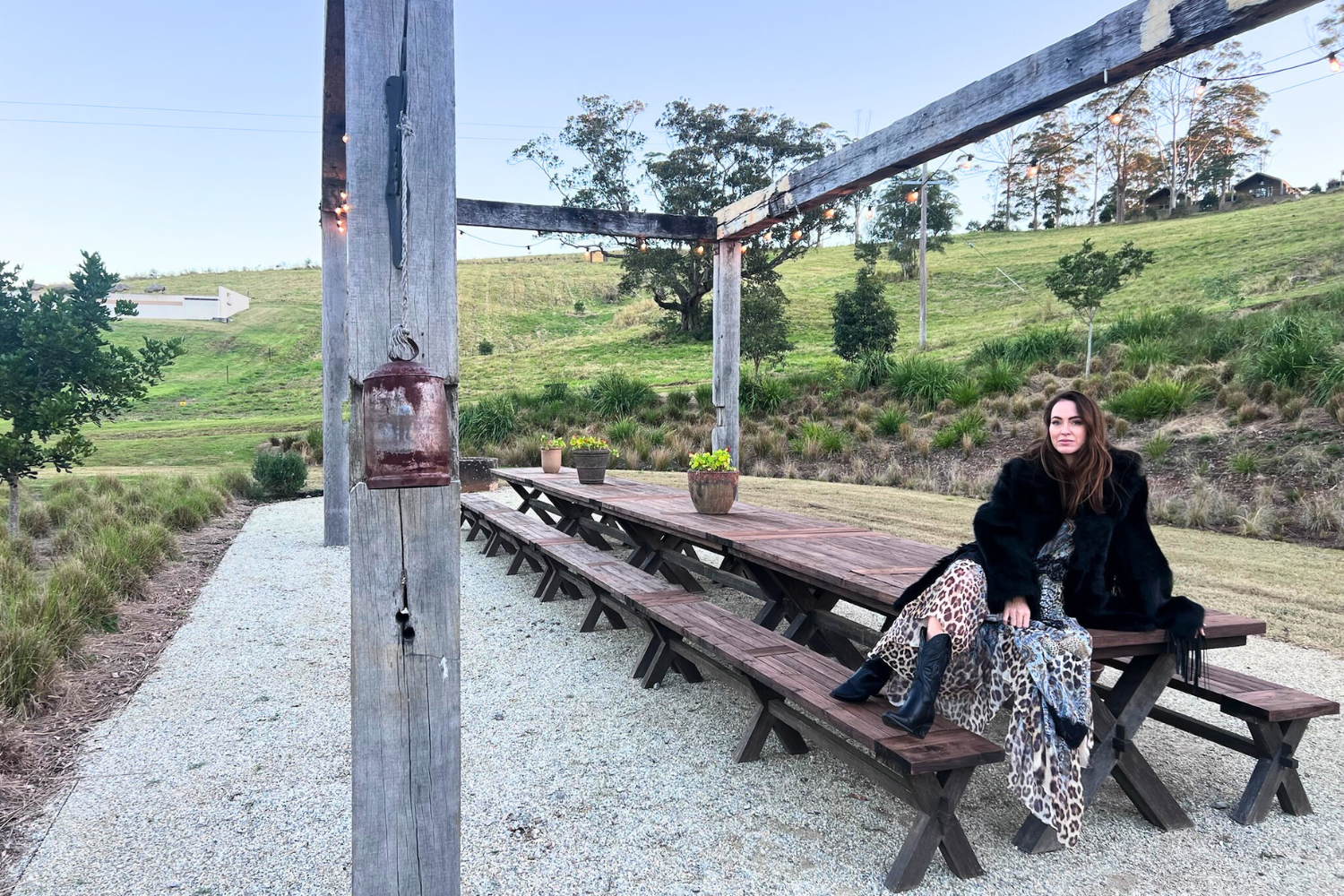 Woman on table looking at view of hinterland